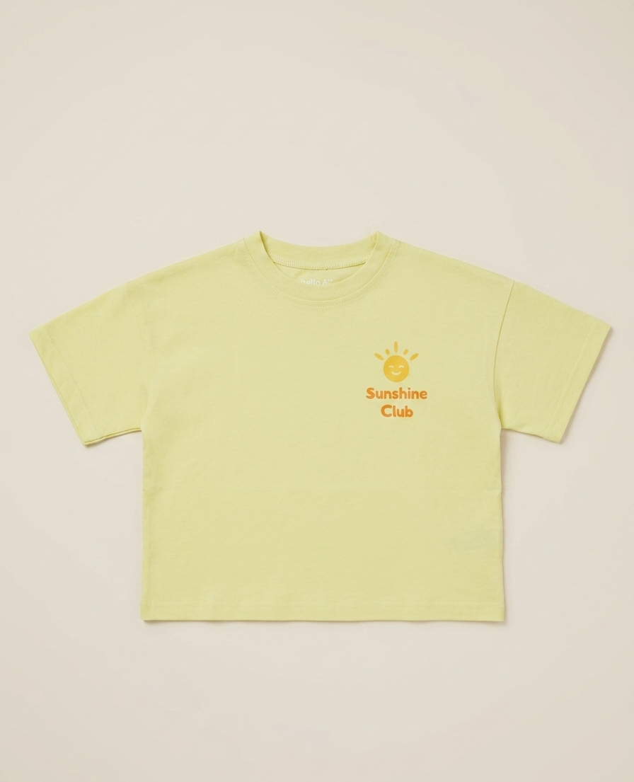 Light yellow t-shirt with 'Sunshine Club' text and logo on a beige background
