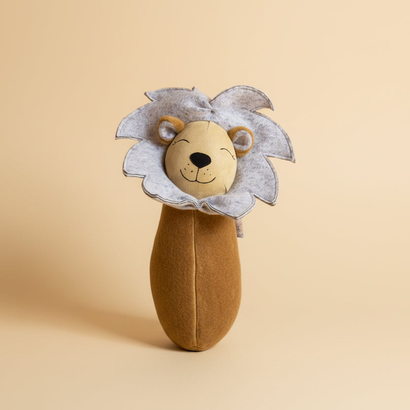Toy lion with a textured mane on a colorful checkered background